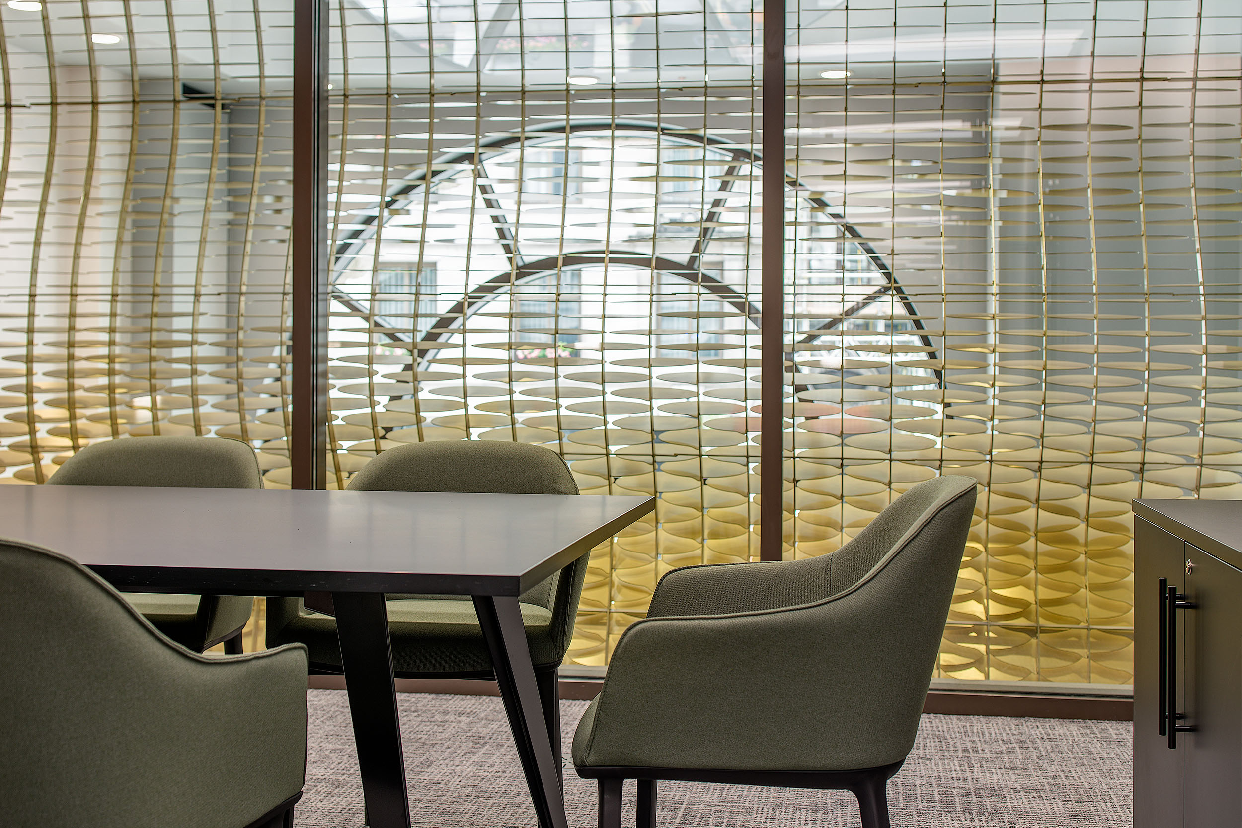 Meeting room at 20 St James Street Level 1, featuring a sleek design with green chairs and decorative wall details.