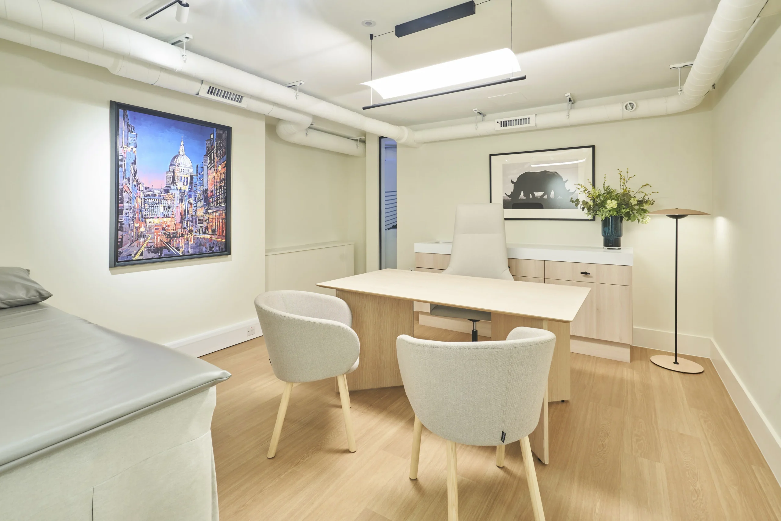 Numa consultation room with wooden furniture and neutral decor - workspace fit-out by Ambit