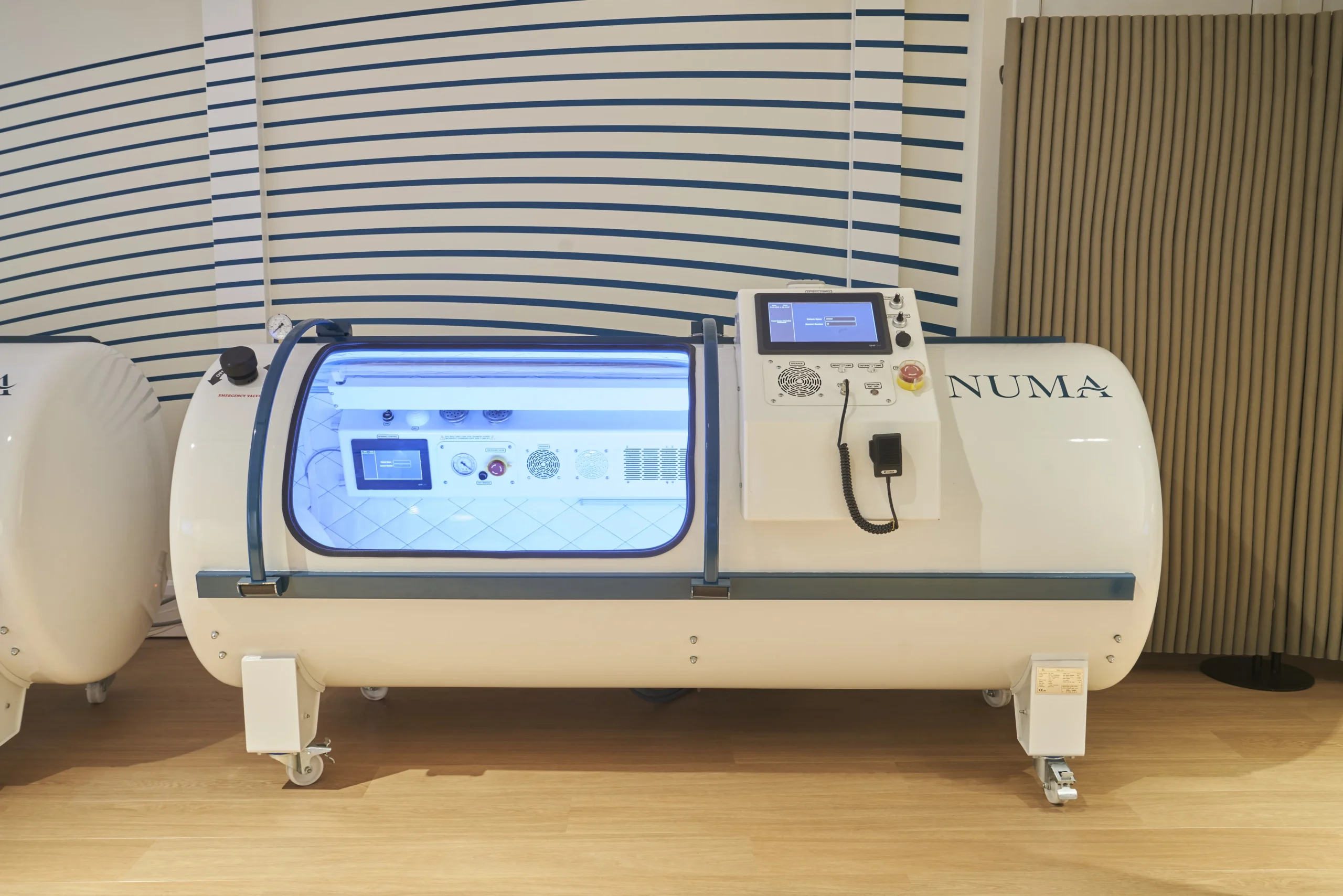 Close-up of hyperbaric chamber at Numa, part of a modern therapy room - Ambit fit-out project