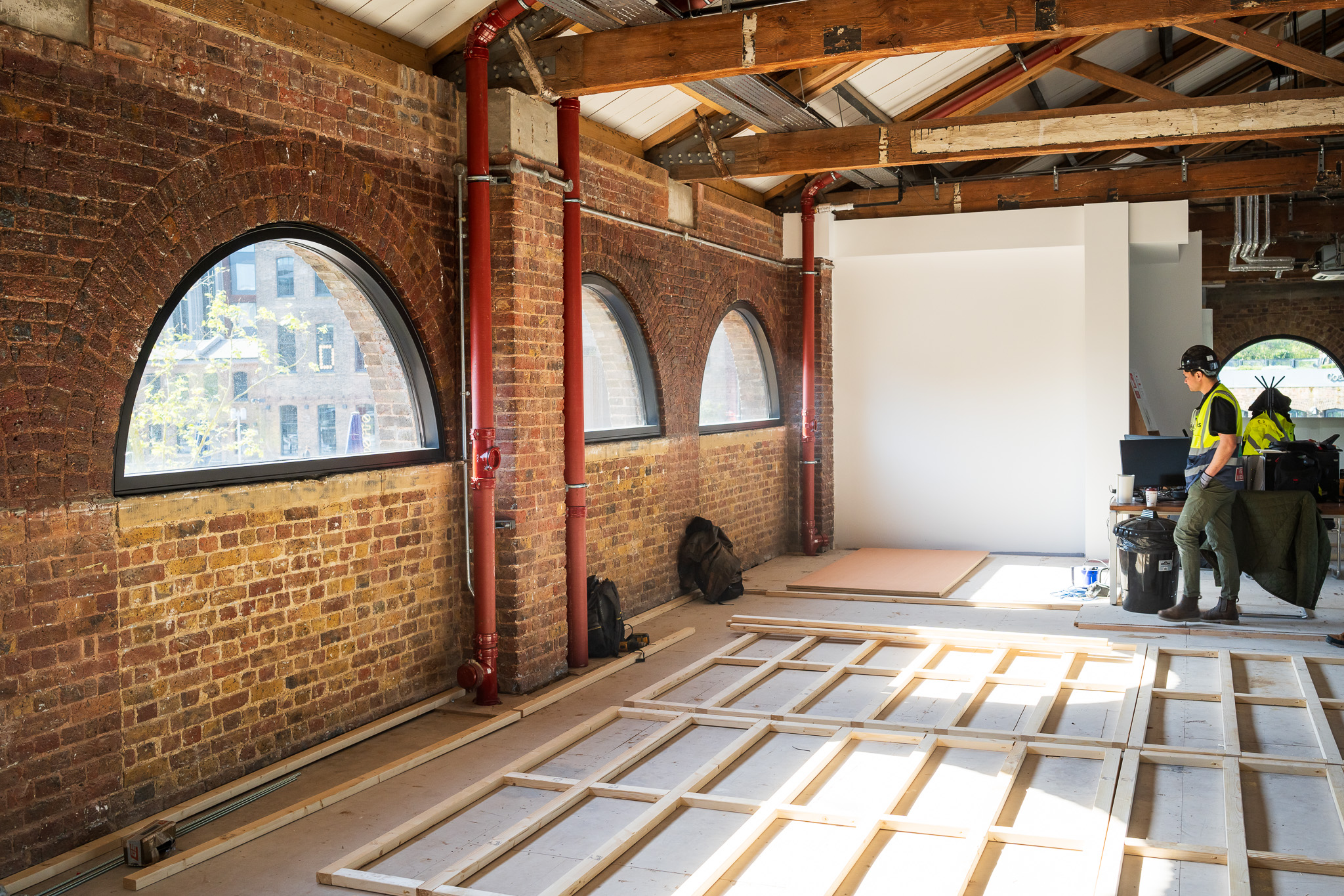 Beams layered in Coal Drops Yard open plan space