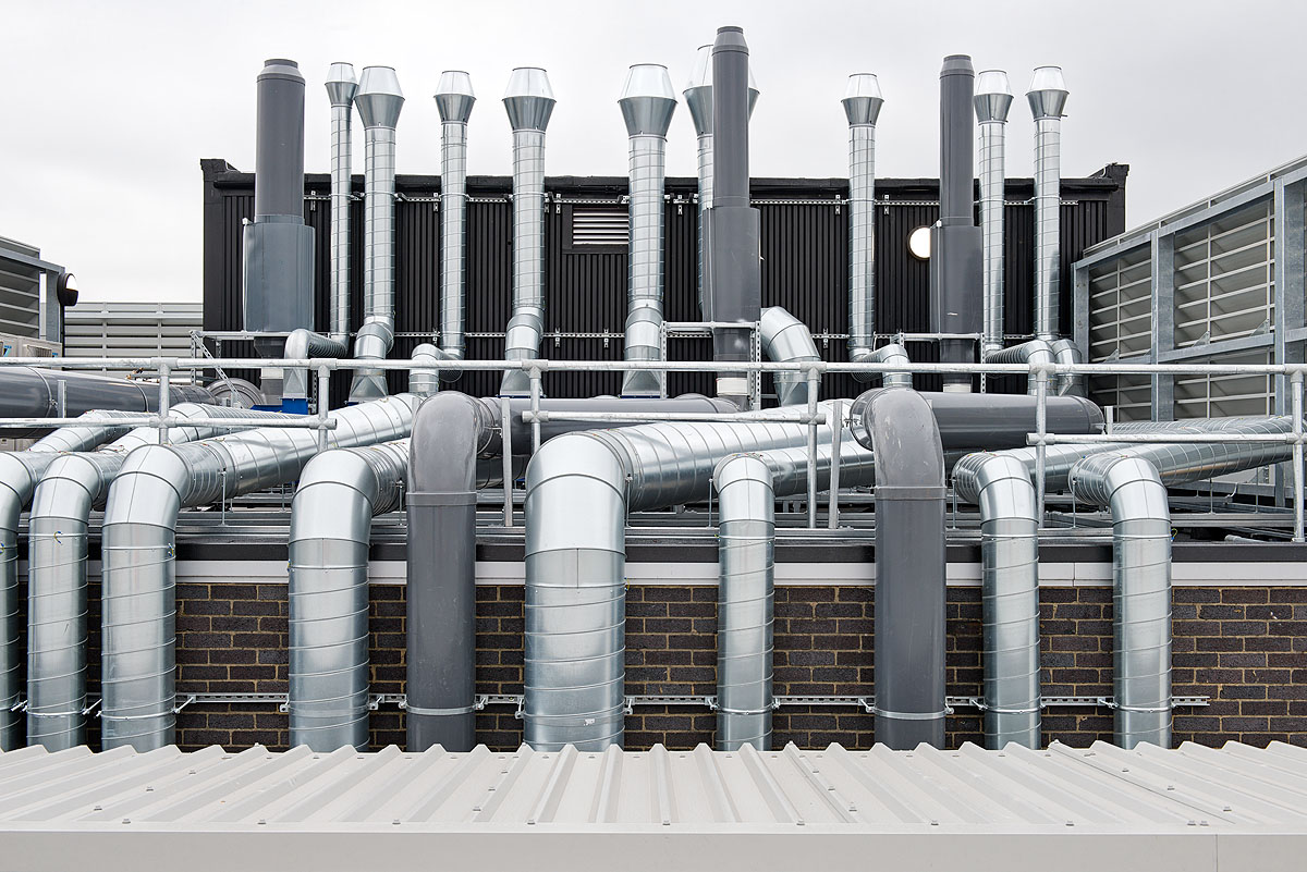 Rooftop ventilation system at Smiths Detection, featuring an extensive network of industrial ducts and pipes designed for optimised airflow and environmental control.