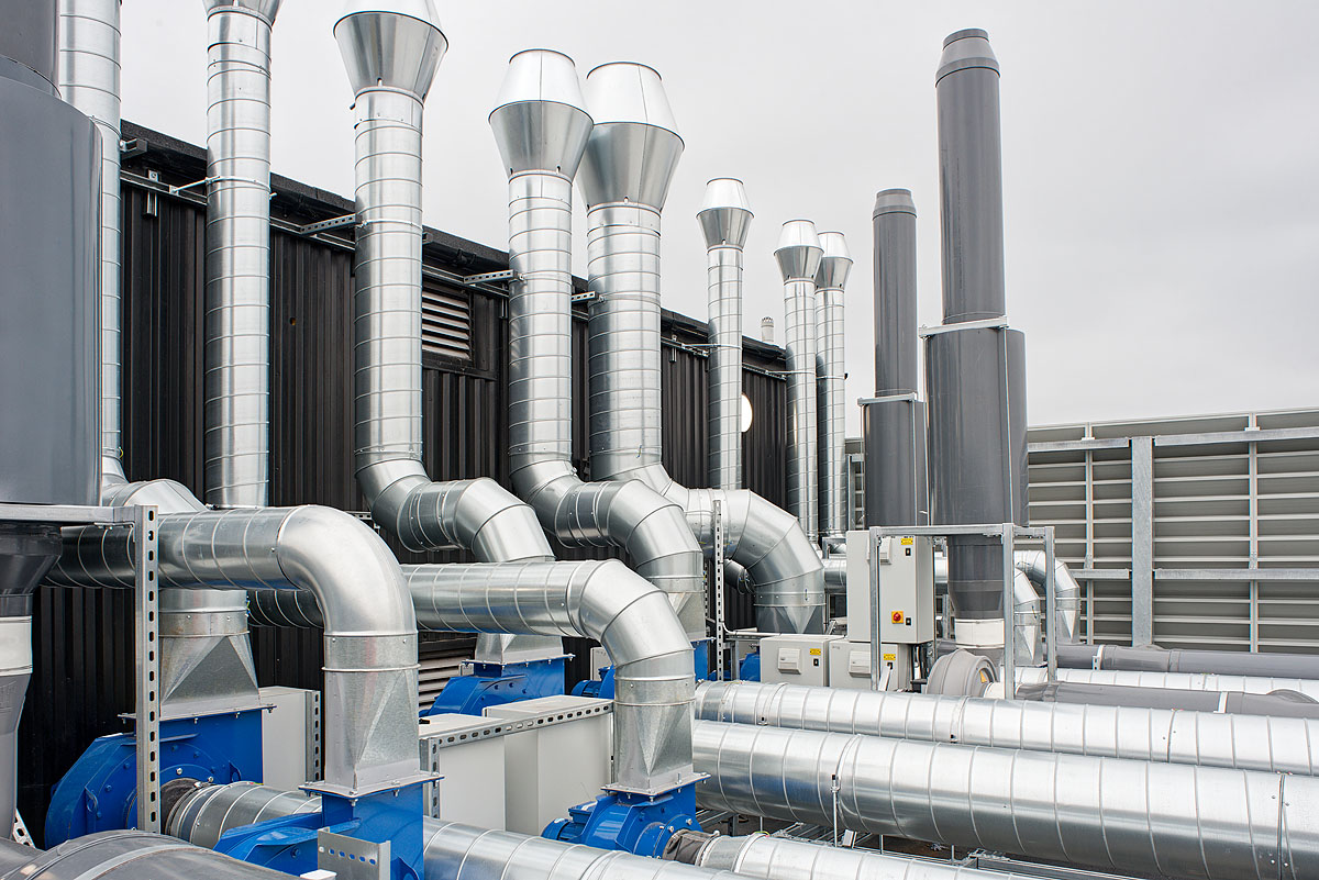 Advanced rooftop ventilation and exhaust system at Smiths Detection, featuring robust ductwork and industrial fans for efficient air management and environmental control.