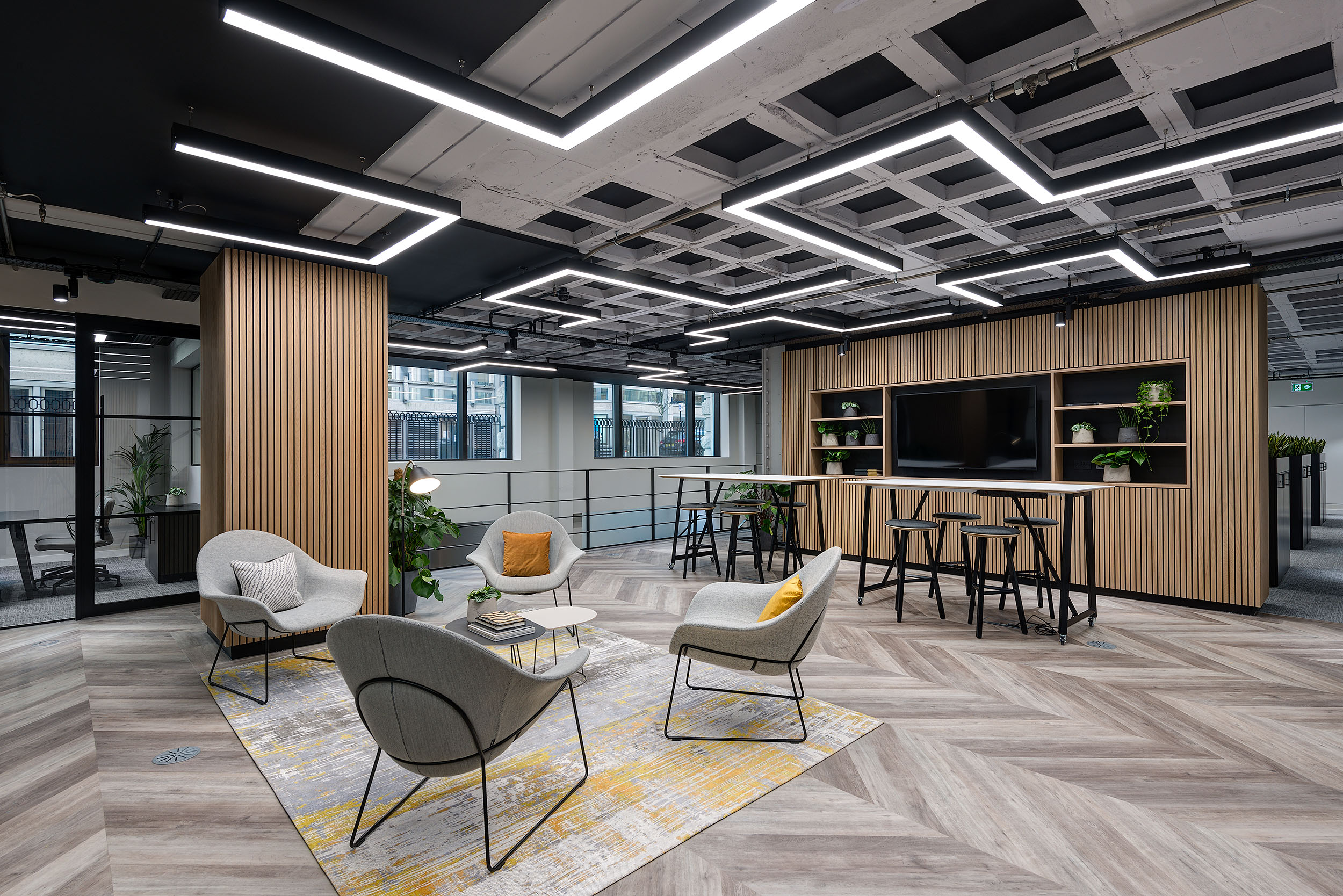 Additional seating area with a muted colour palette of green, yellow and grey.